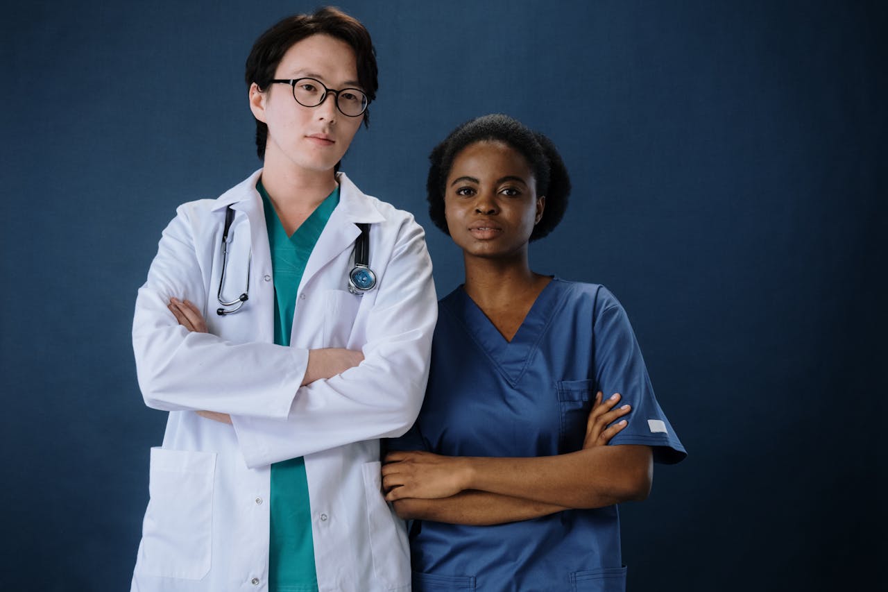 Mastering the First Impression: Your intriguing post title goes here A confident doctor and nurse posing in a studio setting.